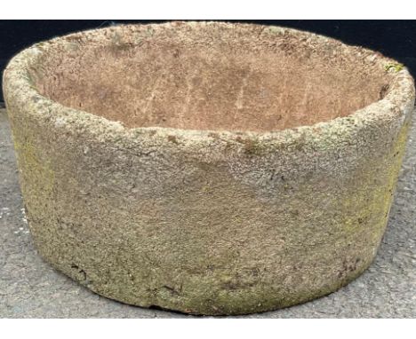A gritstone round stone trough, 45cm diameter 