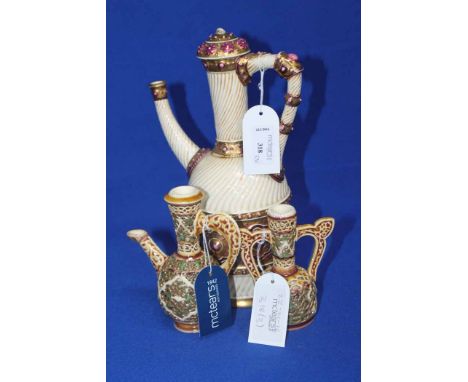 THREE ZSOLNAY PECS PERSIAN-INSPIRED ITEMS
comprising a gilt and jewelled ewer, gadrooned cream ground with applied and pierce