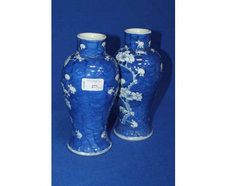 PAIR OF 20TH CENTURY CHINESE PRUNUS VASES
of baluster form, double ring marks to bases, each 22cm high