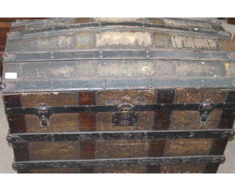 EARLY 20TH CENTURY METAL BOUND WOODEN CAMEL BACKED TRUNK
wooden with metal corners, supports and locks, steel nails, two leat