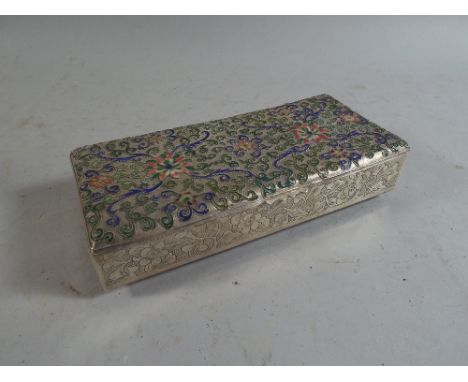 A White Metal Box with Enamel Decoration in Relief.