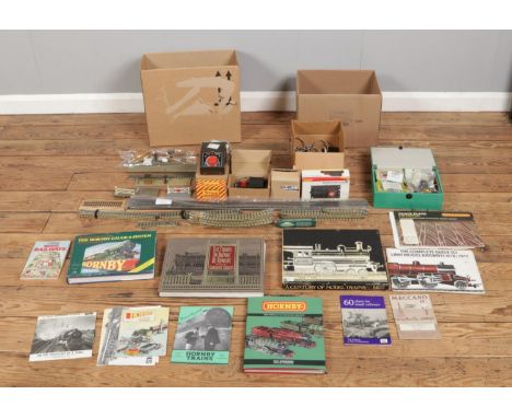 Two boxes of model train equipment, containing Hornby Dublo track, transformers, controllers, power units and a collection of