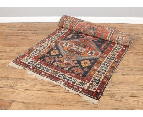 A vintage Persian ground runner, size L307 x W113cm.
