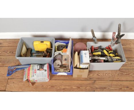 A large box of clips with assorted tools and accessories including drill bits and sanding sheets