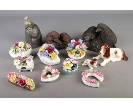 A tray of mixed collectables including Lladro Chinese Monk, Hedgehog figures, Sylvac dogs, Ceramic flower baskets etc