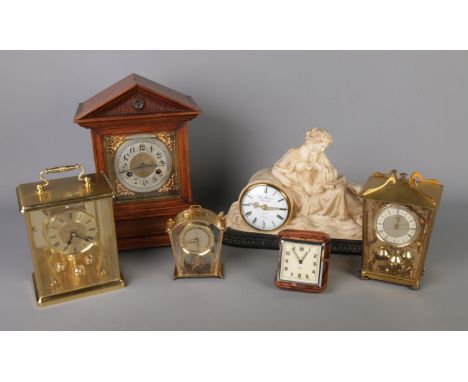 Six assorted mechanical and quartz clocks to include Junghans, Schatz, Thomas Blakemore, etc.
