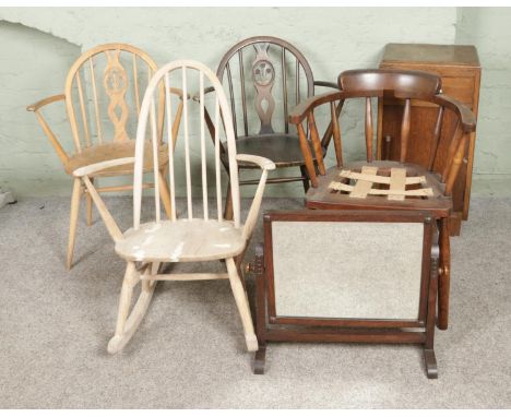 A collection of assorted furniture for restoration to include pair of Ercol fleur de lys chairs, smokers bow armchair, spindl
