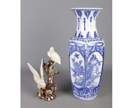 Two pieces of oriental ceramics to include blue and white ceramic vase and a Stork figure group with impressed Foo Dog stamp 