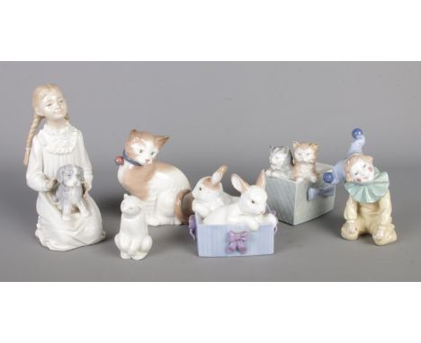 Six Nao by Lladro ceramic figures to include girl with dog, clown, rabbits in basket, kittens, etc.