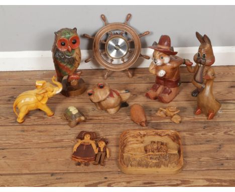 A good collection of treen to include carved novelty animal figures and a Weathermaster barometer in the form of a ships whee