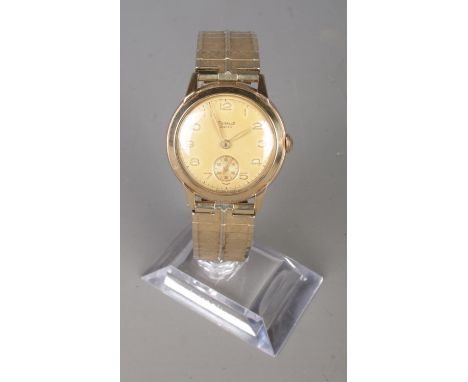 A gents 9ct gold Regalis Andrew manual wristwatch. On gold plated expanding strap.  Running.