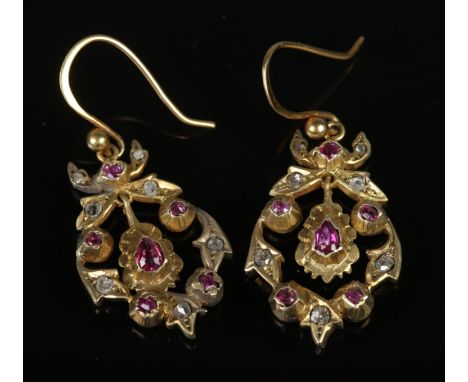 A pair of yellow metal ruby and diamond earrings. 4cm x 2cm.