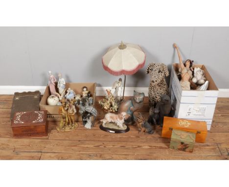 Three boxes of miscellaneous items, including table lamp, rope dog, ceramic cat figurines, small decorative ornaments, LEGO s