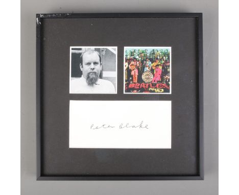 A framed Peter Blake autograph display featuring portrait of the artist and miniature print of the St. Peppers Lonely Hearts 