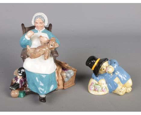 Two ceramic figures to include Royal Doulton 'Nanny' (HN2221) and Coalport 'Paddington Eats an Apple'.