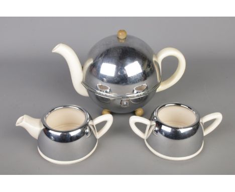 Vintage Art Deco ceramic "Everhot" three piece insulated chrome tea set, comprising teapot, milk jug and sugar bowl, Pat numb