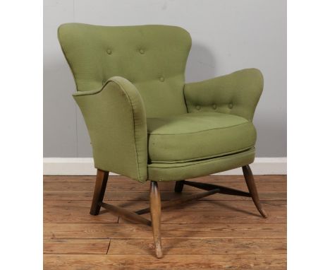 An Ercol tub armchair, model 236, with button back and sides. Upholstered in olive green.