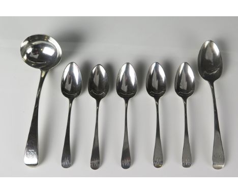 A mixed collection of silver Old English pattern flatwares including teaspoons, dessert spoon, and sauce ladle various makers