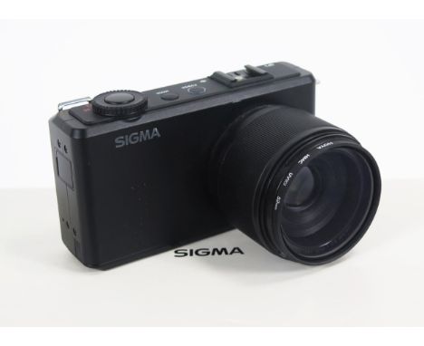 Sigma DP3 Merrill Digital Camera with leatherette exo-case, media transfer cables and battery, in incorrect box