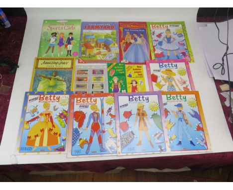 A collection of paper doll, fashion sticker, activity and fashion books, including Barbie Magnetic Album, The ultimate Doll S