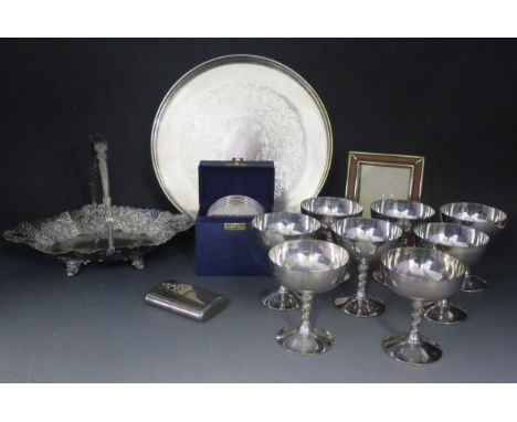 Eight plated champagne goblets, swing handed bread basket, circular serving tray and plated coasters.