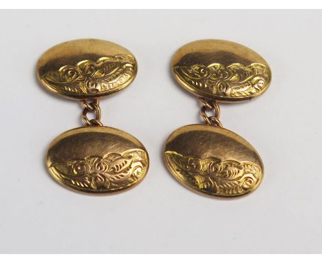 A Pair of Antique 9ct Gold Cufflinks with chased scrolling foliate decoration, Birmingham 1923, 3.31g