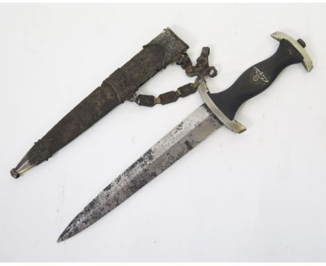 A Third Reich period SS dagger, with 22cm double edged etched blade, wood grip contained in metal scabbard, with chain link h