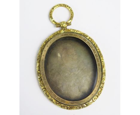A 19th Century Daguerreotype of a Gentleman in a gilt metal in a locket setting,  73.5mm drop.