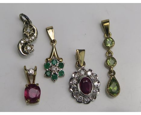 Two 9ct Gold, Ruby and Diamond Pendants, a 9ct white gold diamond pendant, 9ct gold and peridot pendant (26.8mm drop) and an 