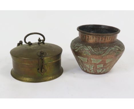 An Indo-Persian brass food box, of circular outline, with shallow domed cover, 22cm diameter, together with a copper jardiniè