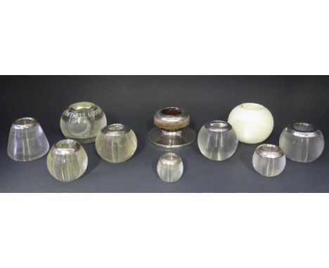 A collection of clear glass and silver mounted match strikers, includes two ceramic examples.