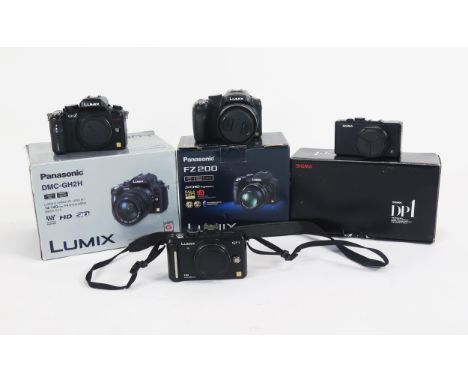 Digital Camera Group of 4 Including Sigma DP1 (with battery, cables and box but no charging dock), Panasonic Lumix FZ 200 (wi