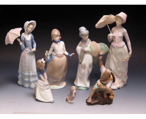 Lladro, Nao and other porcelain figurines, including Geisha girl, lady with parasol. puppy etc.