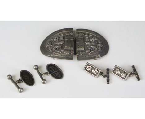 A Chinese silver oval buckle, with raised floral decoration together with two pairs of silver cuff links, total weight of sil