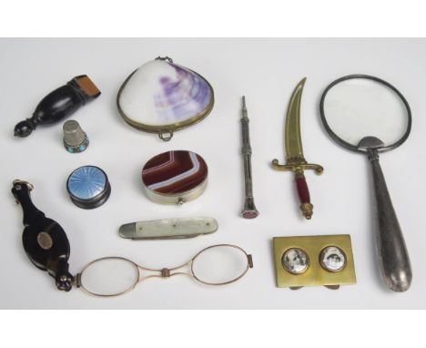 A pair of gilt metal and tortoiseshell lorgnettes, a silver and enamel pill box, a magnifying glass, and other collectables.