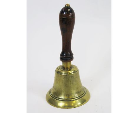 An RAF 'Scramble hand-bell', British, World War II era, circa 1942, the brass bell with stained wooden handle, marked to the 