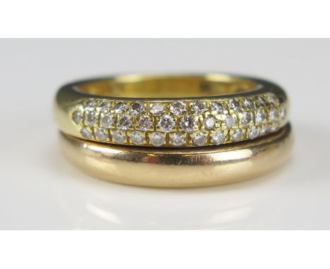 A Piaget 18ct Gold Twin Shank Conjoined Rings, comprising a plain wedding band and a three row half eternity ring, size L.5, 