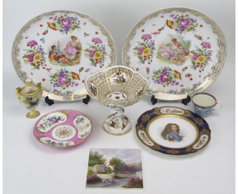 A collection of mostly continental porcelain wares including a pair of large chargers, decorated with lovers in a wooded bowe