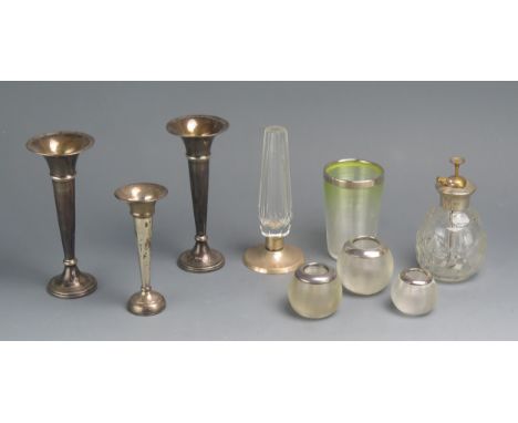 Three silver trumpet shaped specimen vases, silver mounted clear glass atomiser, dressing table jars etc.
