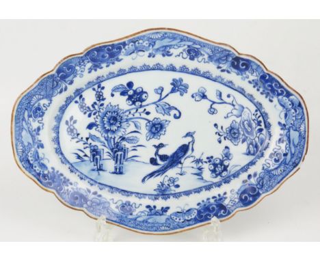 A Chinese blue and white oval platter with exotic birds and floral decoration, 30cm wide.