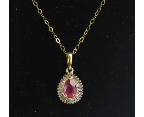 A 9K Gold, Ruby and Baguette Cut Diamond Pendant (stamped 9K on chain, c. 6.9x5mm pear cut stone, 19.5mm drop., 45cm chain (s
