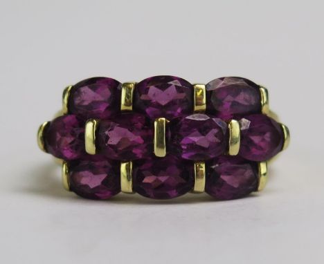 A 14K Gold and Garnet Dress Ring, size R, stamped 14K, 5.8g