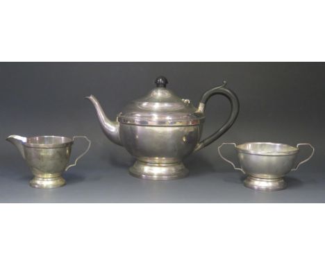 A George V silver three-piece tea service, maker A L Davenport Ltd, Birmingham, 1932, of plain circular firm, total weight of