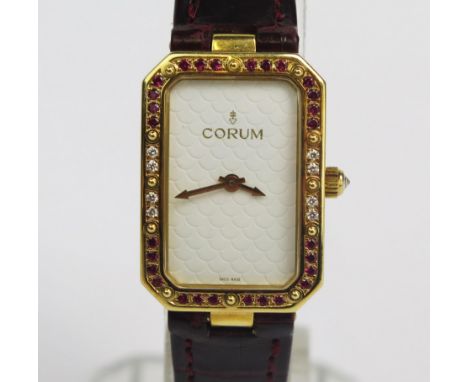A CORUM 18K Gold, Ruby and Diamond Quartz Wristwatch, 29x20.5mm case, back no. 24.706.65 557338, original strap with 18K clas