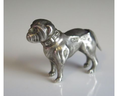 A George V silver miniature novelty pin cushion, maker H J Cooper &amp; Co Ltd, Birmingham, 1912, in the form of a dog, 4.5cm