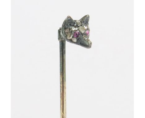 A 15ct Gold and Rose Cut Diamond Fox Head Pin with cabochon ruby eyes, 56.5mm long, stamped 15, 1.17g