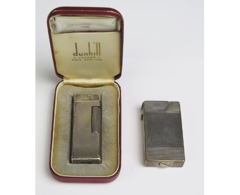 A Dunhill Rollagas lighter, initialled, in original case with instruction leaflet, flints and cleaning brush,  together with 