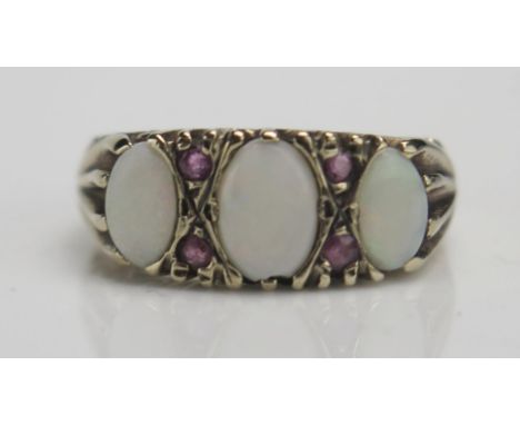 A 9ct Gold, Opal and Ruby Ring, size M, hallmarked, 3.18g