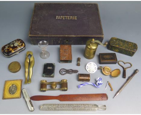 A blonde tortoiseshell and inlaid purse, a pair of opera glasses, papier mache snuff boxes, pepper mill, and other collectabl