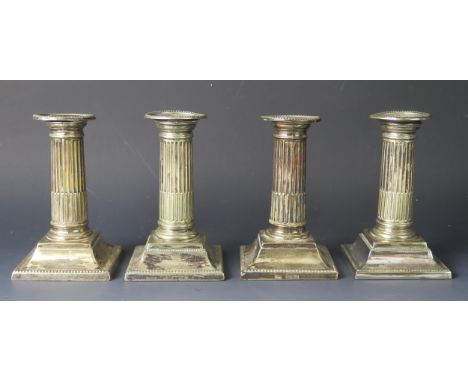 A pair of Victorian silver candlesticks, maker Harrison Brothers & Howson, Sheffield, 1893, the nozzles on plain stop fluted 